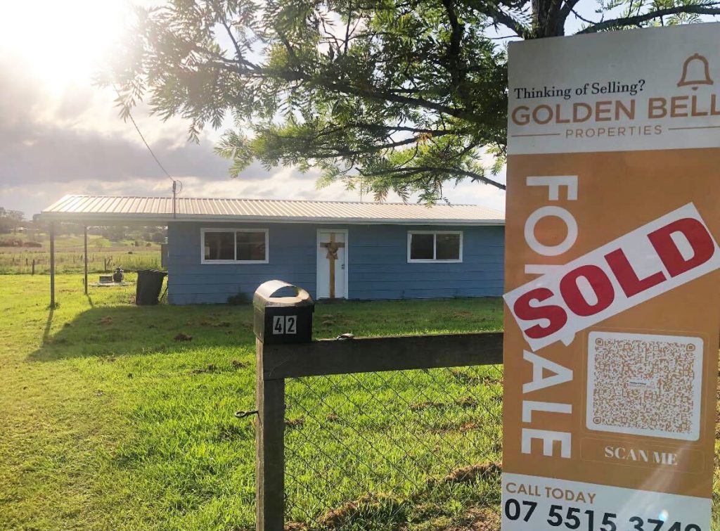 Golden Bell Sold Signage at front of property