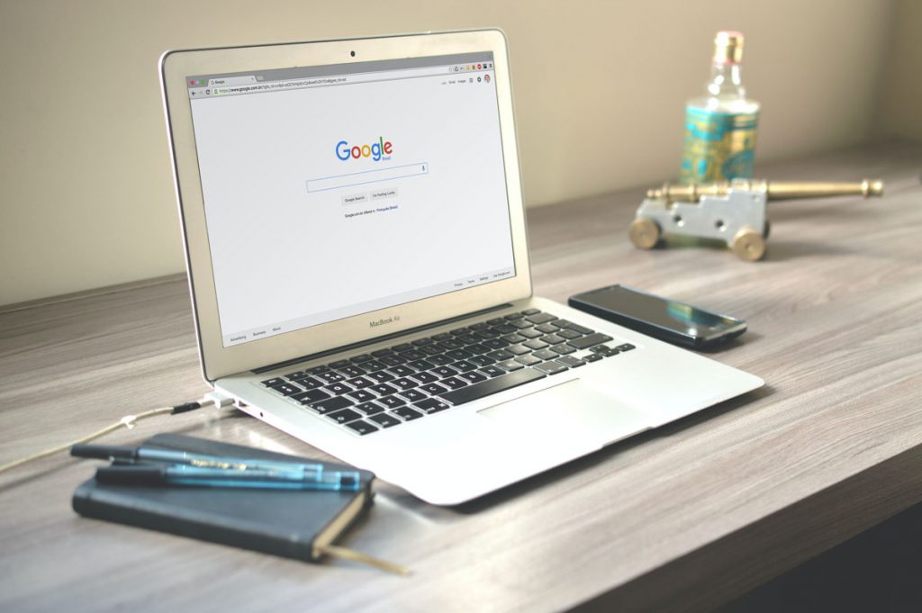 Laptop on table with Google Search